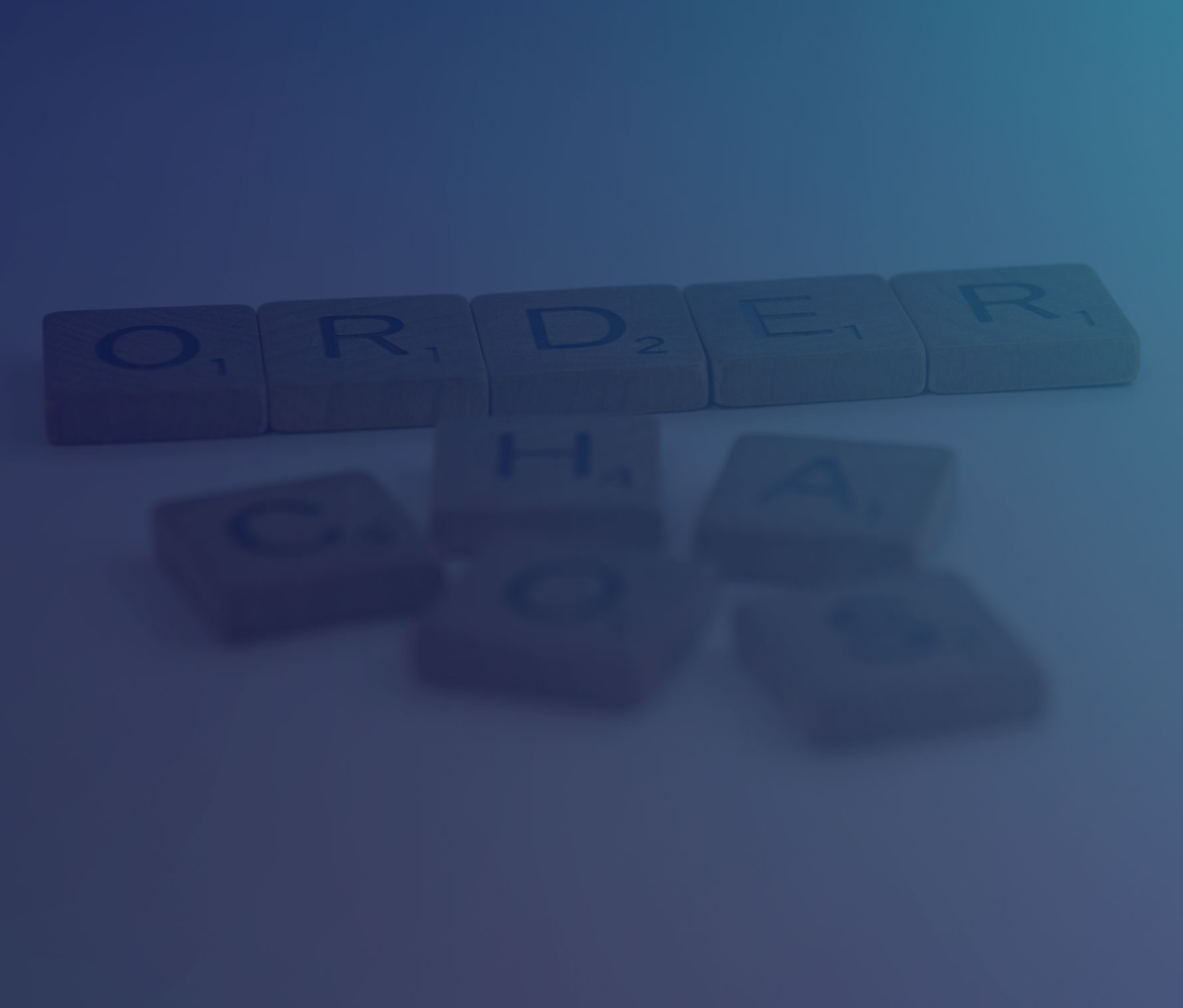 Scrabble tiles forming the words Order and Chaos