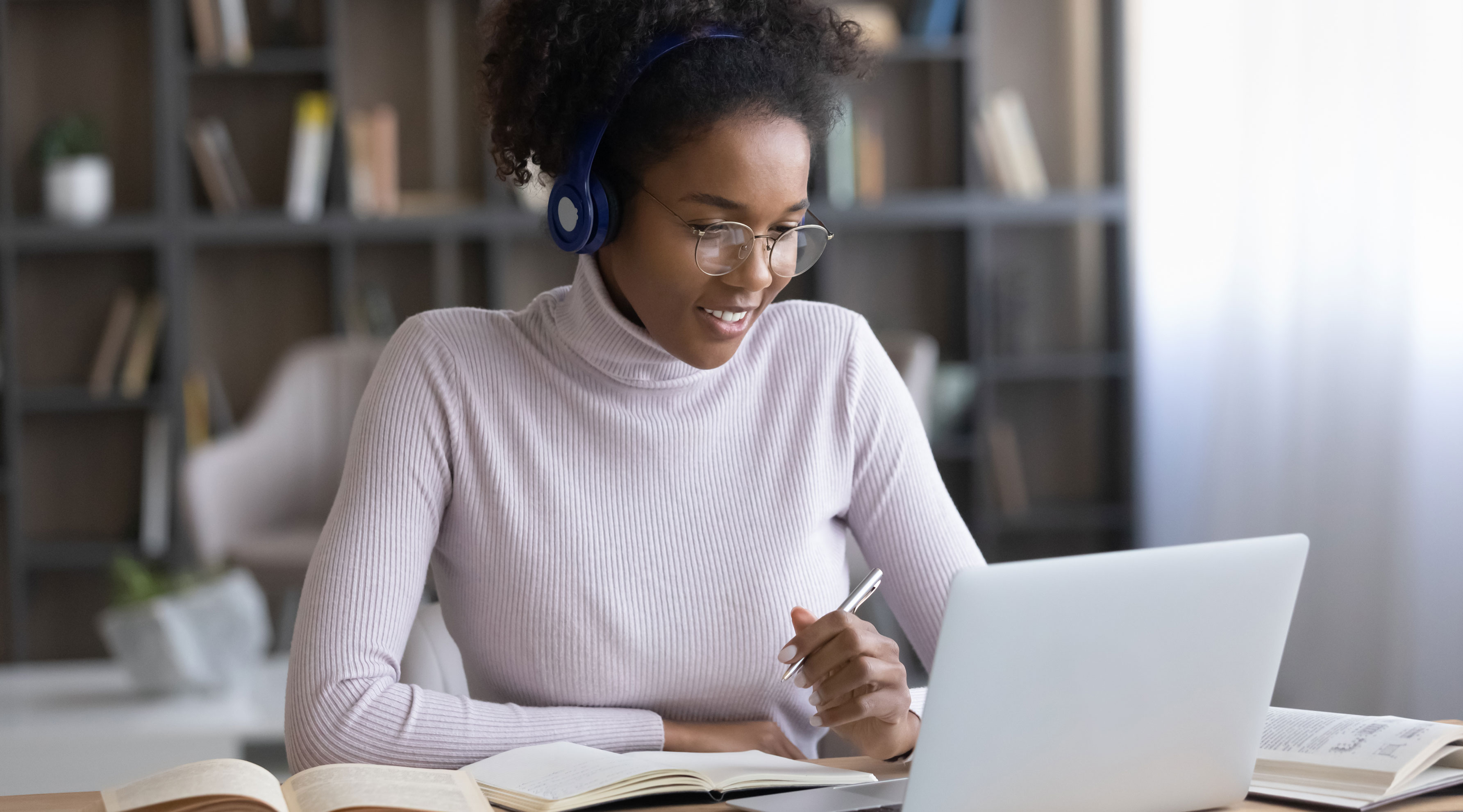Woman using laptop to learn online