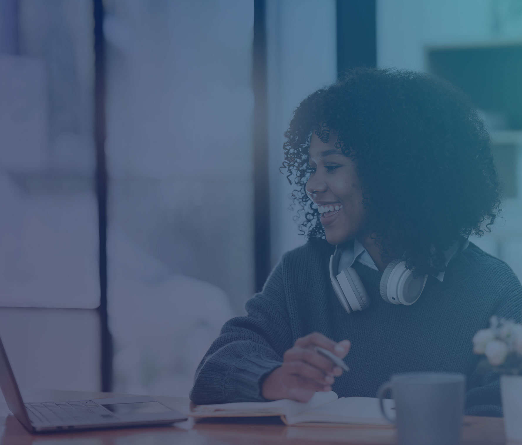 Smiling woman working on a laptop