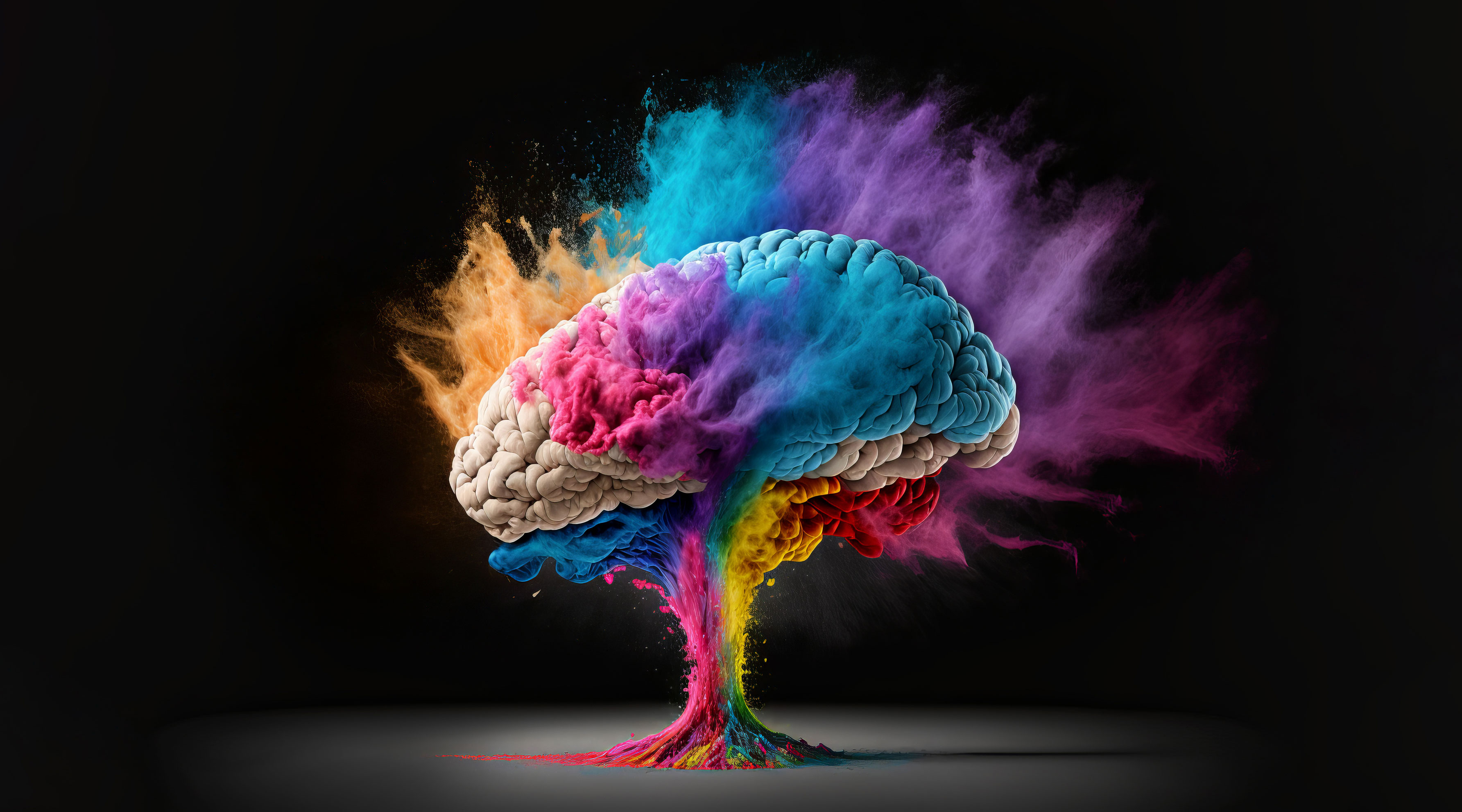 Stylized image of a brain with colorful powder expanding off of it