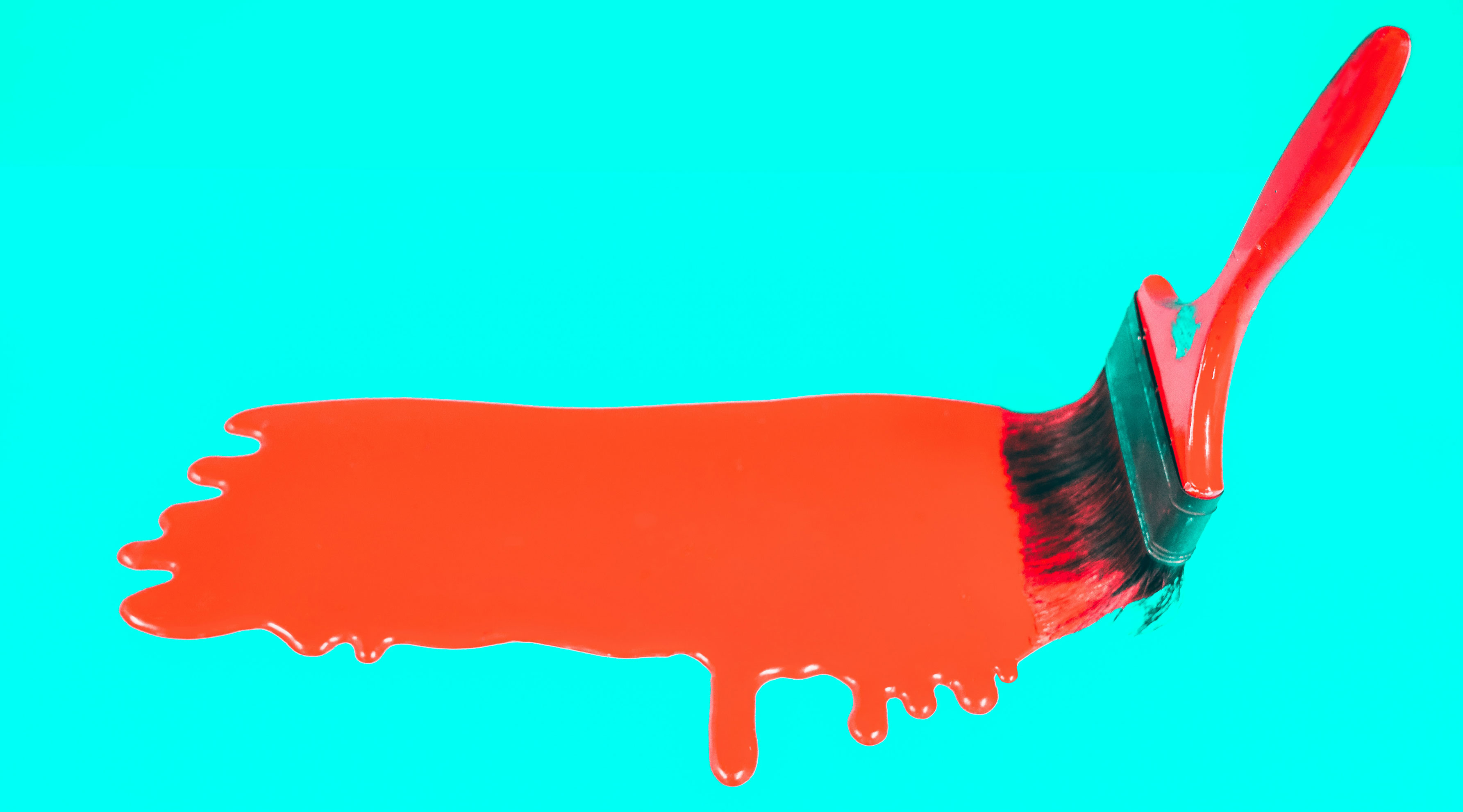 Paintbrush painting across surface