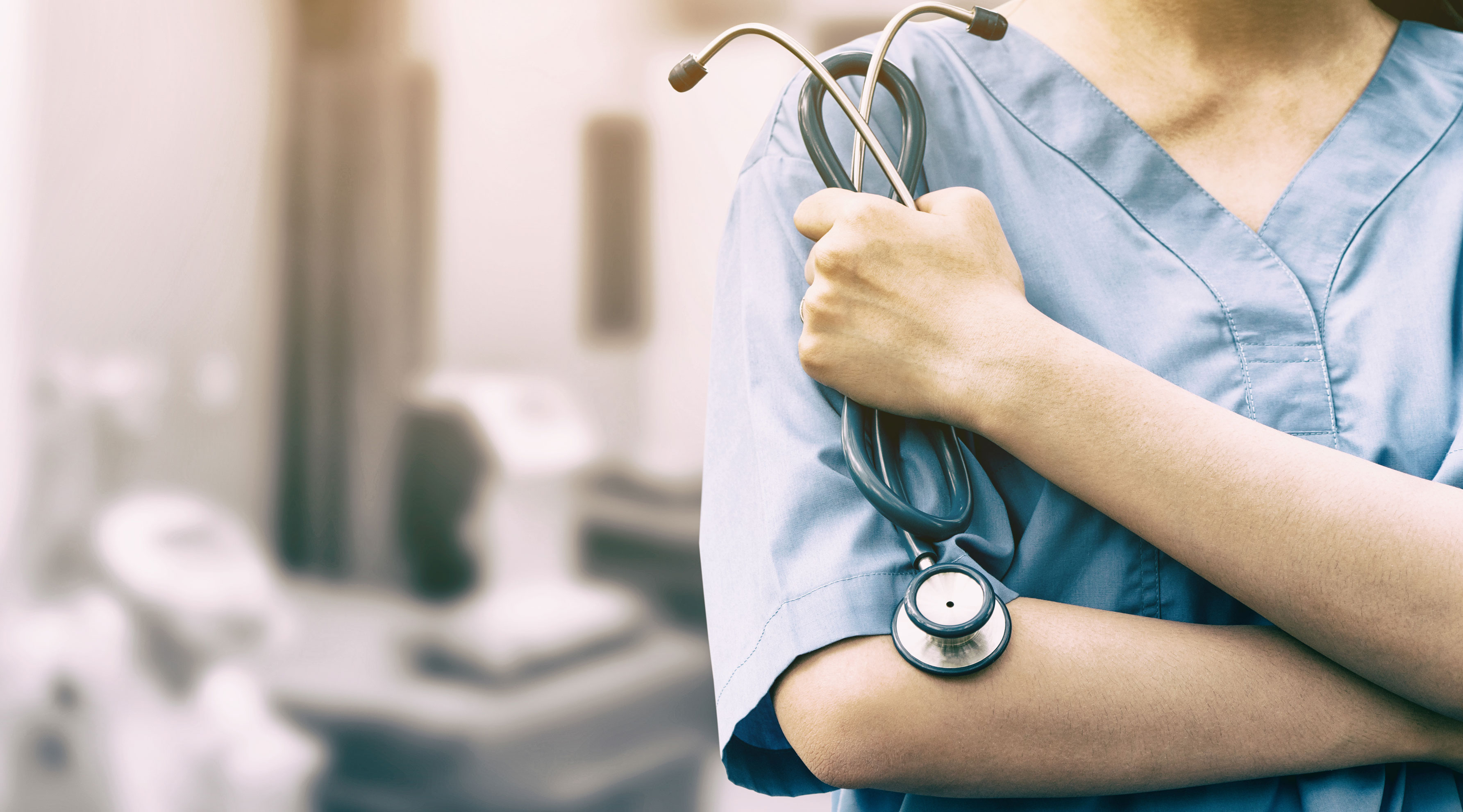 Medical professional holding a stethoscope 